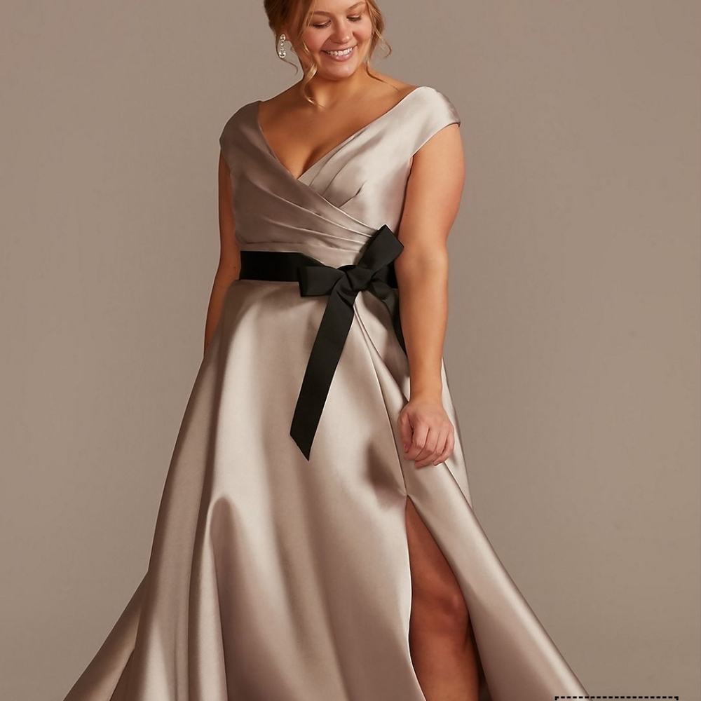 Champagne colored dress with black ribbon belt.